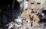 People search for survivors in the rubble of a building destroyed in an Israeli strike in Jabalia, in the northern Gaza Strip on March 18, 2025. (Photo by Bashar Taleb / AFP)
