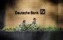 FILE PHOTO: People walk past a Deutsche Bank office in London, Britain July 8, 2019. REUTERS/Simon Dawson