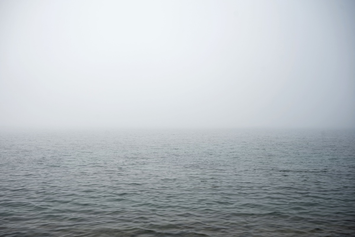 This photograph shows the sea covered in fog and dust at Palaio Faliro suburb, on the Saronic Gulf coast, south of Athens, on March 15, 2025. (Photo by Angelos TZORTZINIS / AFP)