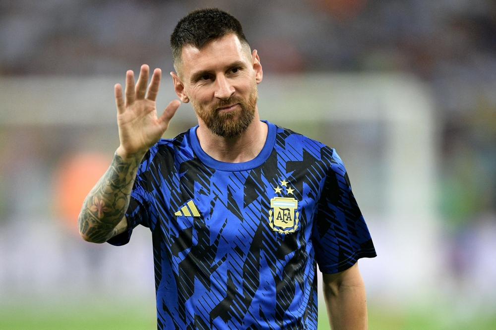 (Files) Argentina's forward Lionel Messi waves as he warms up before the 2026 FIFA World Cup South American qualification football match between Brazil and Argentina at Maracana Stadium in Rio de Janeiro, Brazil, on November 21, 2023. (Photo by Carl De Souza / AFP)