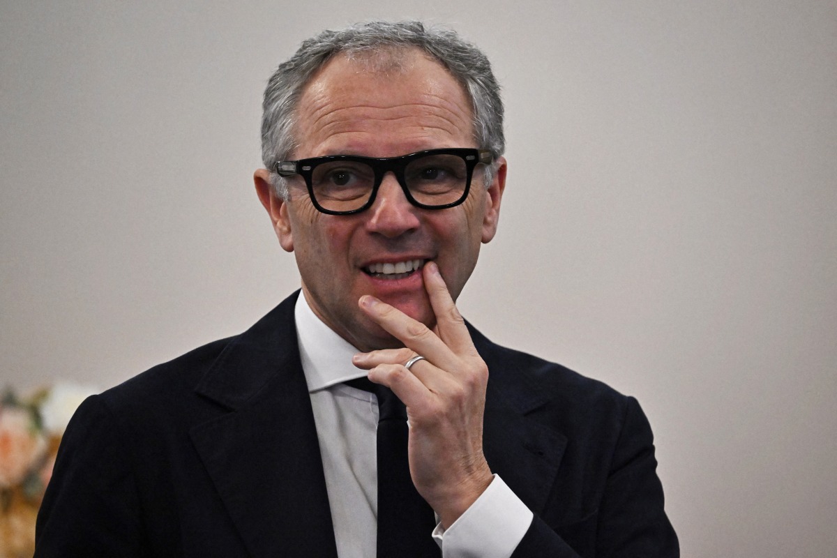 Formula One CEO Stefano Domenicali arrives before meeting Thailand's Prime Minister Paetongtarn Shinawatra at the Government House in Bangkok on March 18, 2025. Photo by Lillian SUWANRUMPHA / AFP