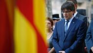 President of the Catalan regional Government Carles Puigdemont sings the official national anthem during a wreath-laying ceremony at the Rafael de Casanovas monument in Barcelona on September 11, 2016, on the day of the National Day of Catalonia 