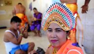 This picture taken on July 20, 2016 shows deaf people preparing to perform a traditional dance at Bengkala vilage in Singaraja regency on Bali island. AFP / SONNY TUMBELAKA 