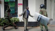 Kenyan policemen beat a protester during clashes in Nairobi, Kenya May 16, 2016. REUTERS/Goran Tomasevic