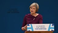 British Prime Minister Theresa delivers a keynote address on the final day of the annual Conservative Party conference at the International Convention Centre in Birmingham, central England, on October 5, 2016. / AFP / PAUL ELLIS\