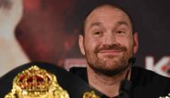 (FILES) This file photo taken on April 27, 2016 shows 
British heavyweight boxer Tyson Fury reacts during a press conference. / AFP / OLI SCARFF