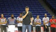 Retired Chinese basketball superstar Yao Ming, tallest, and players of Houston Rockets take part in a basketball camp event in Shanghai, China, 8 October 2016.