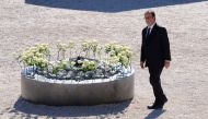 French President Francois Hollande walks past white roses, each representing one of the 86 victims, during the ceremony in tribute to the victims and the families of the fatal truck attack three months ago, in Nice, France, October 15, 2016. REUTERS/Jean-