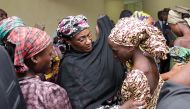 Nigeria's Vice President Yemi Osinbajo (not seen) and Nigeria's Minister of Information and Culture Alhaji Lai Mohammed (not seen) welcome some of the freed Chibok school girls at the state House in Abuja, Nigeria on October 13, 2016. Twenty-one of the Ch