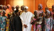 Some of the 21 Chibok schoolgirls released by Boko Haram pose during a group photograph with President Muhammadu Buhari and Vice President Yemi Osinbajo In Abuja, Nigeria October 19, 2016 REUTERS/Afolabi Sotunde