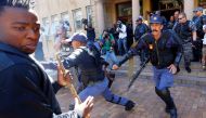 University of Cape Town students clash with police as stun grendes are used during protests demanding free tertiary education in Cape Town, South Africa, October 17, 2016. REUTERS/Mike Hutchings