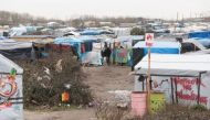 The ramshackle camp at Calais houses thousands of migrants and refugees attempting to make it to Britain, which bars most of them on the basis of EU rules requiring them to seek asylum in the first European country they set foot in. (AFP / Denis Charlet) 