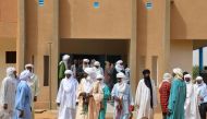 A picture taken on October 19, 2016 shows local officials leaving the town hall following a meeting with Niger's interior minister to discuss security issues in their region following the kidnapping of a US aid worker on October 14 by armed men in Abalak 