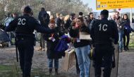 French policemen talk to volunteers in the 