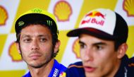 Movistar Yamaha MotoGP’s Italian rider Valentino Rossi (left) looks on as Repsol Honda Team’s Spanish rider Marc Marquez addresses a press conference ahead of the 2016 MotoGP Malaysian Grand Prix at Sepang International Circuit in Sepang, Malaysia, yester