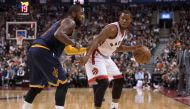 Toronto Raptors guard Kyle Lowry (7) dribbles the ball as Cleveland Cavaliers guard Kyrie Irving (2) defends during the third quarter at Air Canada Centre. The Cavaliers won 94-91.  Credit: Nick Turchiaro