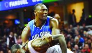 Orlando Magic centre Bismack Biyombo (11) grabs Cleveland Cavaliers forward LeBron James (23) during the second half at Quicken Loans Arena on Saturday. The Cavaliers won 105-99.