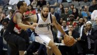 Deron Williams #8 of the Dallas Mavericks dribbles the ball past Shabazz Napier #6 of the Portland Trail Blazers in the second half at American Airlines Center on November 4, 2016 in Dallas, Texas. Ronald Martinez/AFP
