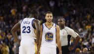 Stephen Curry #30 and Draymond Green #23 of the Golden State Warriors complain to referee Leroy Richardson during their game against the New Orleans Pelicans at ORACLE Arena on November 7, 2016 in Oakland, California. Ezra Shaw/Getty Images/AFP