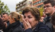 A Kosovar woman cries as she pays her respects beside the casket of activist and Vetevendosje opposition party leader Astrit Dehari after he 'suspiciously' died in prison, on November 8, 2016 in Pristina. Medical student Dehari died on November 6 at the p