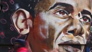 A man walks past a mural of US President Obama painted on a wall in Nairobi, Kenya, on November 8, 2016. Enthusiasm for the outgoing president has faded on a continent that he is accused of forsaking. The election of the first black president of the Unite