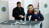 People cast ballots during a presidential election at a polling station in Chisinau, Moldova, November 13, 2016. REUTERS/Gleb Garanich