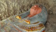 A handout picture released by Egypt's Antiquities Ministry on November 13, 2016 shows a sarcophagus containing a millennia-old mummy which was found by Spanish archaeologists near the southern Egyptian town of Luxor. The body was found in a tomb likely da