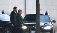 German Chancellor Angela Merkel leaves the chancellery after a meeting with party leaders of Germany's ruling coalition Sigmar Gabriel and Horst Seehofer, in an new attempt to reach consensus on a nominee to replace outgoing president Joachim Gauck, on No