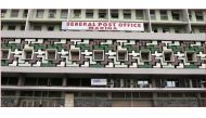 People walk past the general post office in the central business district in Lagos January in this 2012 file photo. REUTERS/Akintunde Akinleye