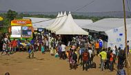 Newly arrived refugees from South Sudan queue in line waiting to be registered on November 11, 2016 at Kuluba Reception Centre in Koboko District, North of the capital Kampala during the EU Commissioner for Humanitarian and Crisis Management visit to Ugan