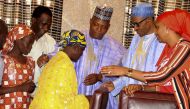 File photo of Nigerian president Muhammadu Buhari meeting with the rescued girl Amina Ali Nkeki and her mother Binta Ali Nkeki with Governor Kashim Shettima of Borno State at the Presidential villa in Abuja, May 2016.  (EPA) 