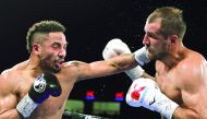 Andre Ward of the US (left) throws a left at Sergey Kovalev of Russia during their WBA, IBF and WBO light heavyweight world championship fight in Las Vegas, US on Saturday.