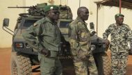 Malian military soldiers stand near an armoured vehicle that belongs to the French Army at the Malian military Command Post in Sevare.Photo: Reuters