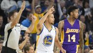 Stephen Curry #30 of the Golden State Warriors celebrates after making a three-point shot over Brandon Ingram #14 of the Los Angeles Lakers in the first half of their NBA basketball game at ORACLE Arena on November 23, 2016 in Oakland, California. Thearon