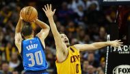 Dallas Mavericks guard Seth Curry (30) shoots over the defense of Cleveland Cavaliers forward Kevin Love (0) during the second half at Quicken Loans Arena. The Cavs won 128-90. Mandatory Credit: Ken Blaze-USA TODAY Sports
