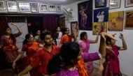 A twenty-six year old Kishan Manocha (3rd L) participates in an Odissi dance lesson under the tutelage of acclaimed dancer Madhumita Raut inside a garage-turned-studio in New Delhi. Class participants range from from pre-teens to surgeons and marketing ma