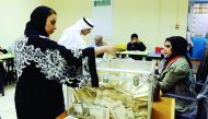 A Kuwaiti woman casts her vote.