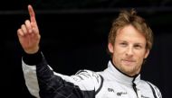 FILE PHOTO - Brawn GP Formula One driver Jenson Button of Britain waves after qualifying in pole position for the Spanish F1 Grand Prix at the Catalunya racetrack in Montmelo, near Barcelona, May 9, 2009. REUTERS/Dani Cardona/File Photo
