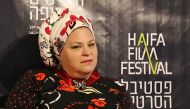 Israeli film director Rama Burshtein poses for a photograph during the Haifa Film Festival on October 20, 2016, in Haifa. Burshtein's team includes all the usual movie-making roles, but with a couple of exceptions: her rabbi and an assistant who keeps her