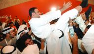 Independent deputy candidate Yousuf Saleh Al Fadale celebrates after the results of Kuwaiti parliamentary election to choose 50 lawmakers are announced in Adailiya, suburb of Kuwait City on November 27, 2016. (Jaber Abdulkhaleg - Anadolu Agency)