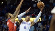 Oklahoma City Thunder guard Russell Westbrook (0) shoots the ball in front of Washington Wizards forward Markieff Morris (5) during the fourth quarter at Chesapeake Energy Arena. Mandatory Credit: Mark D. Smith-USA TODAY Sports