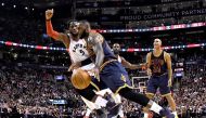 Cleveland Cavaliers forward LeBron James (23) drives to the basket past Toronto Raptors forward DeMarre Carroll (5) in the first half at Air Canada Centre. Dan Hamilton-USA TODAY Sports