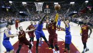 Cleveland Cavaliers guard Kyrie Irving (2) takes a shot against Golden State Warriors forward Draymond Green (23) at Quicken Loans Arena. Cleveland defeats Golden State 109-108.  Brian Spurlock