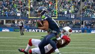 (FILES) This file photo taken on December 24, 2016 shows wide receiver Tyler Lockett(front) #16 of the Seattle Seahawks pulls in a catch against the Arizona Cardinals at CenturyLink Field in Seattle, Washington.  AFP / OTTO GREULE JR
