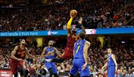 Cleveland Cavaliers forward LeBron James (23) takes a shot against Golden State Warriors center JaVale McGee (1) at Quicken Loans Arena. Cleveland defeats Golden State 109-108. Brian Spurlock