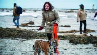 Monica Farell walks four-months-old tiger baby 