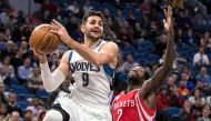 Minnesota Timberwolves guard Ricky Rubio (9) passes around Houston Rockets guard Patrick Beverley (2) during the third quarter at Target Center. The Timberwolves defeated the Rockets 119-105. Mandatory Credit: Brace Hemmelgarn-USA TODAY Sports