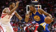 Golden State Warriors forward Kevin Durant (35) dribbles the ball as Houston Rockets forward Trevor Ariza (1) defends during the third quarter at Toyota Center. Troy Taormina
