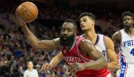 Houston Rockets guard James Harden (13) controls a rebound past Philadelphia 76ers guard Timothe Luwawu-Cabarrot (20) during the third quarter at Wells Fargo Center. The Houston Rockets won123-118. Mandatory Credit: Bill Streicher-USA TODAY Sports
