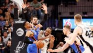 San Antonio Spurs small forward Kawhi Leonard (right) is fouled by Oklahoma City Thunder point guard Russell Westbrook (left) during the second half at AT&T Center. Soobum Im-USA TODAY Sports